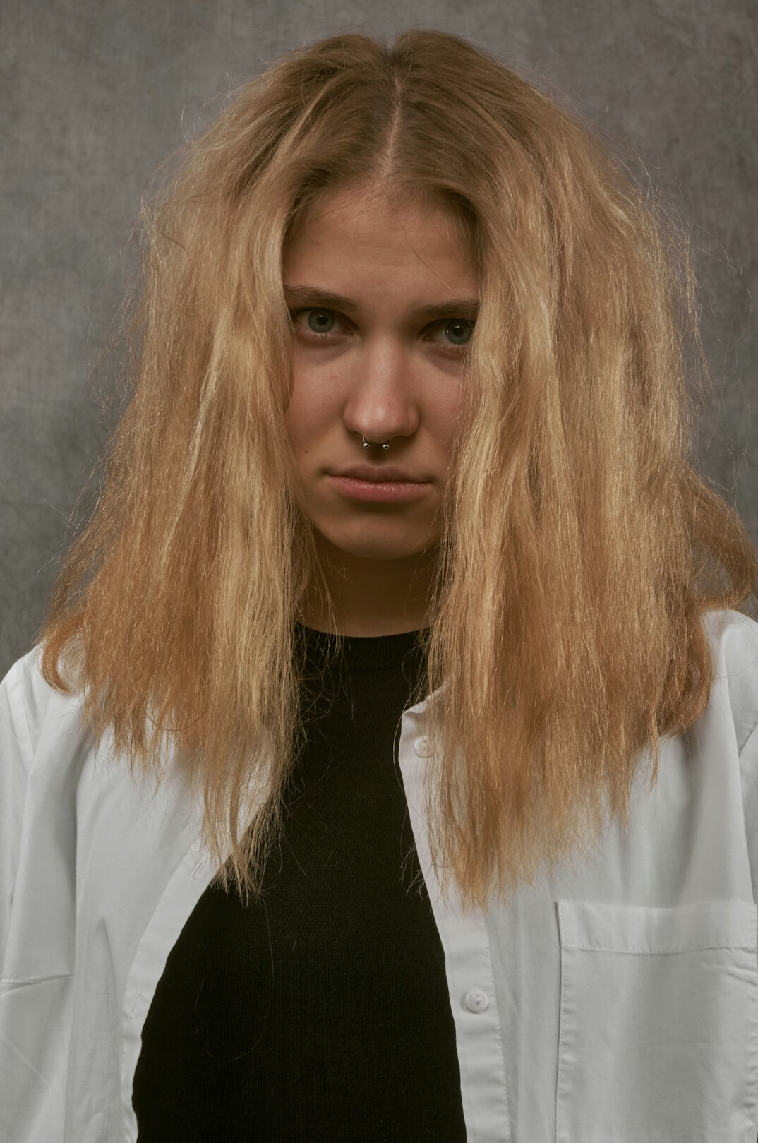 Studio portrait of a woman research director with short blonde hair