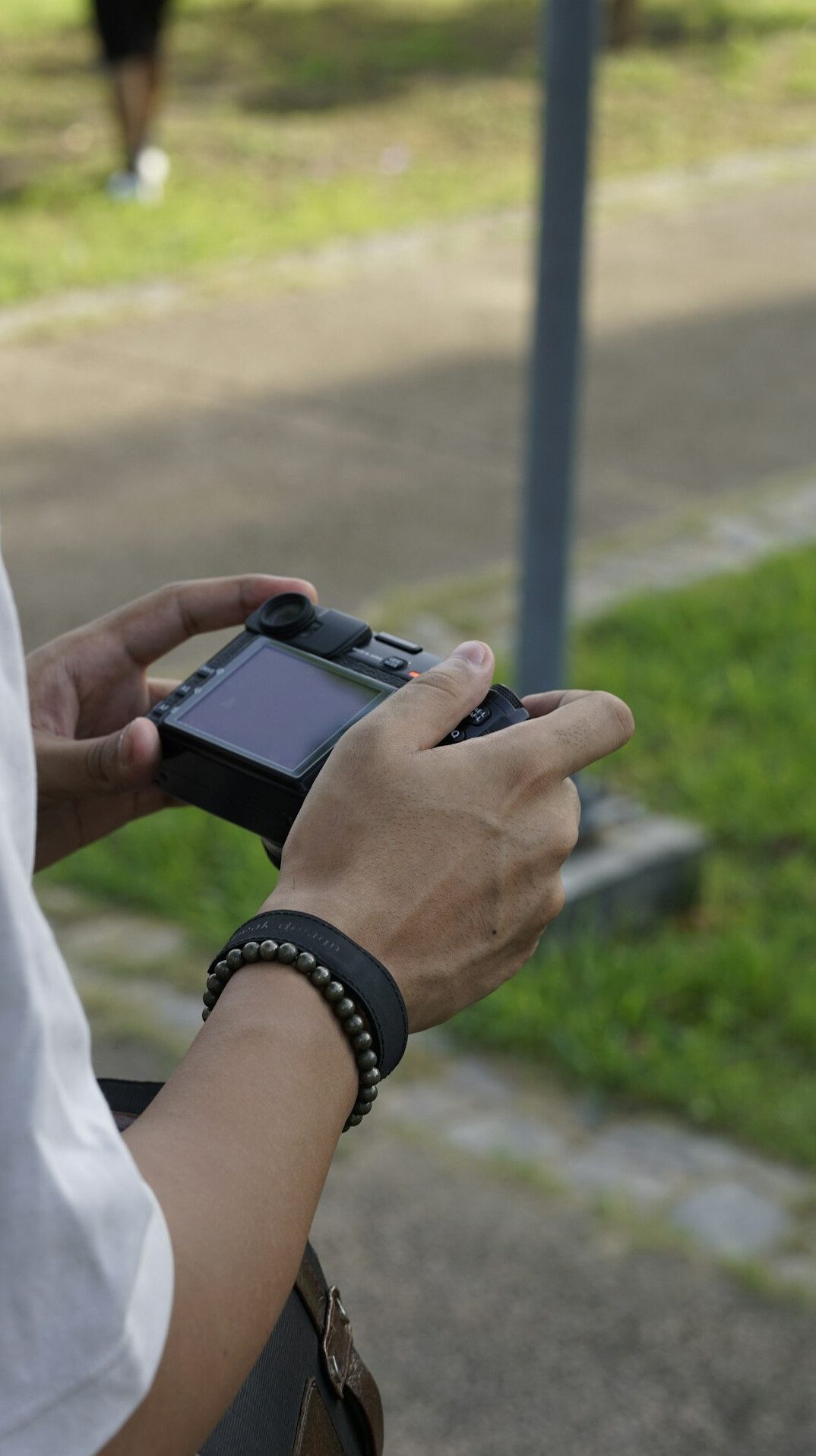 Close-up of hands reviewing survey questionnaire data on a tablet
